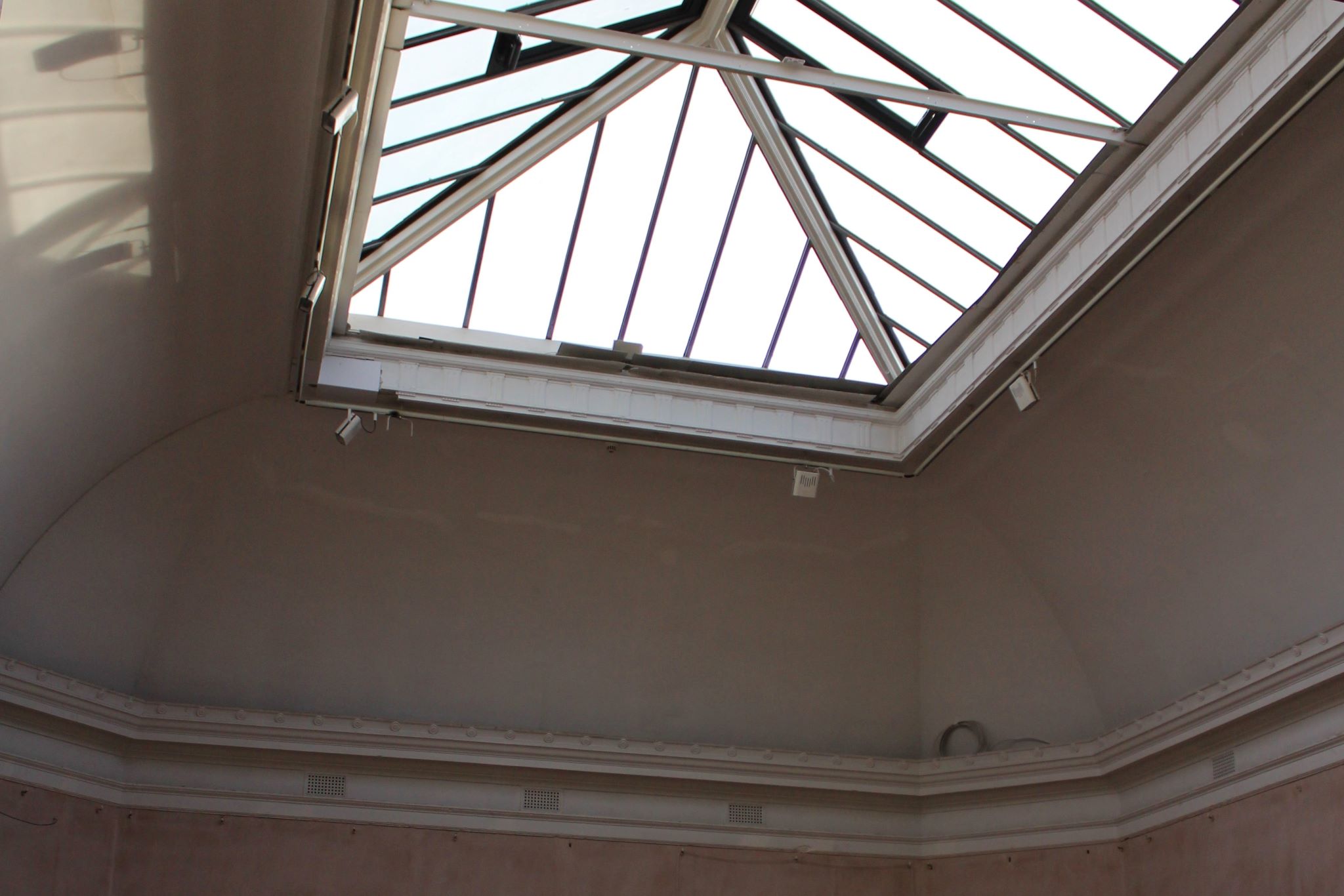 Internal view looking up at rooflight windows with some view of gallery wall detail 