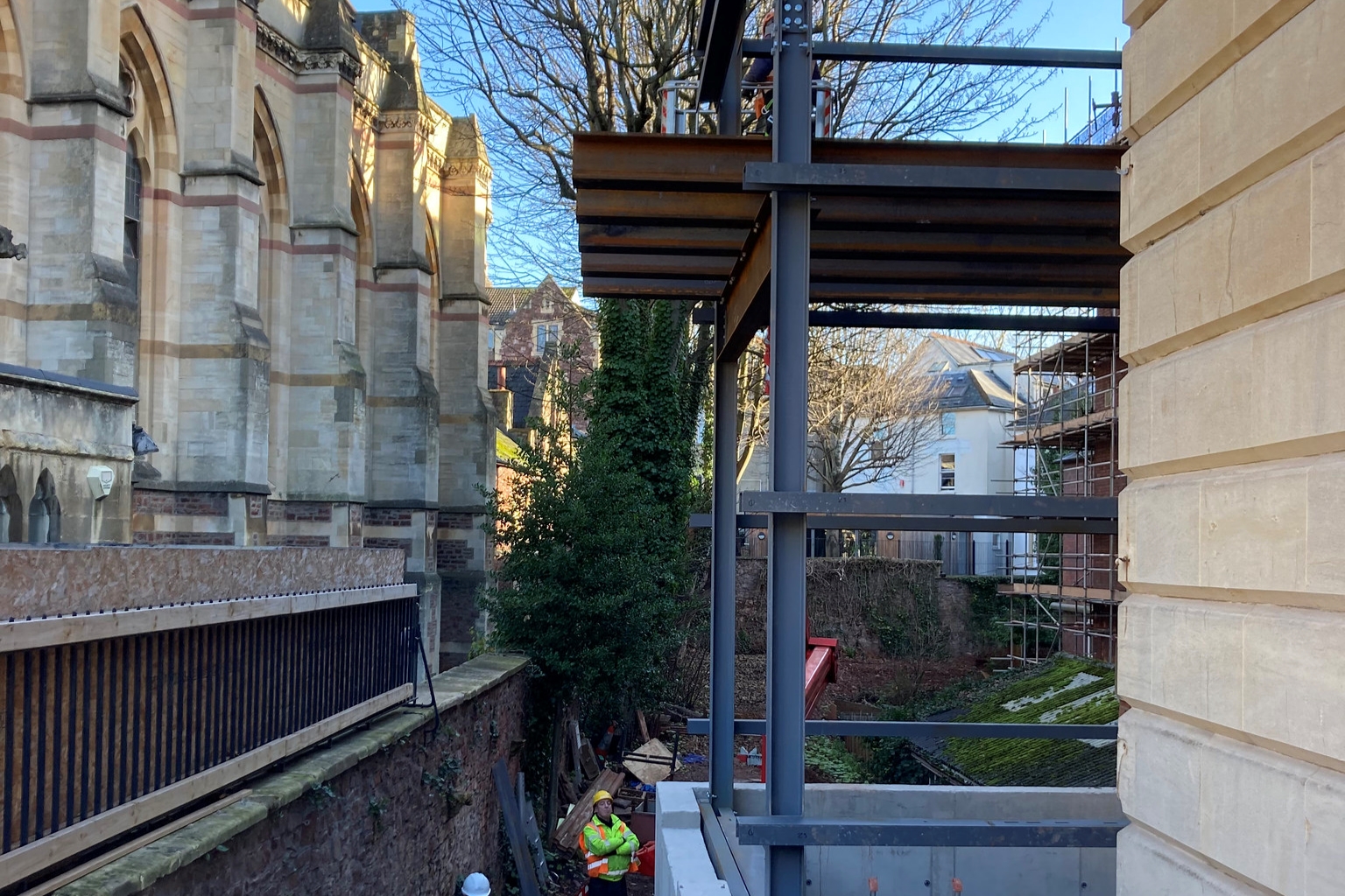 Steelwork of a lift structure against the side of the RWA building 