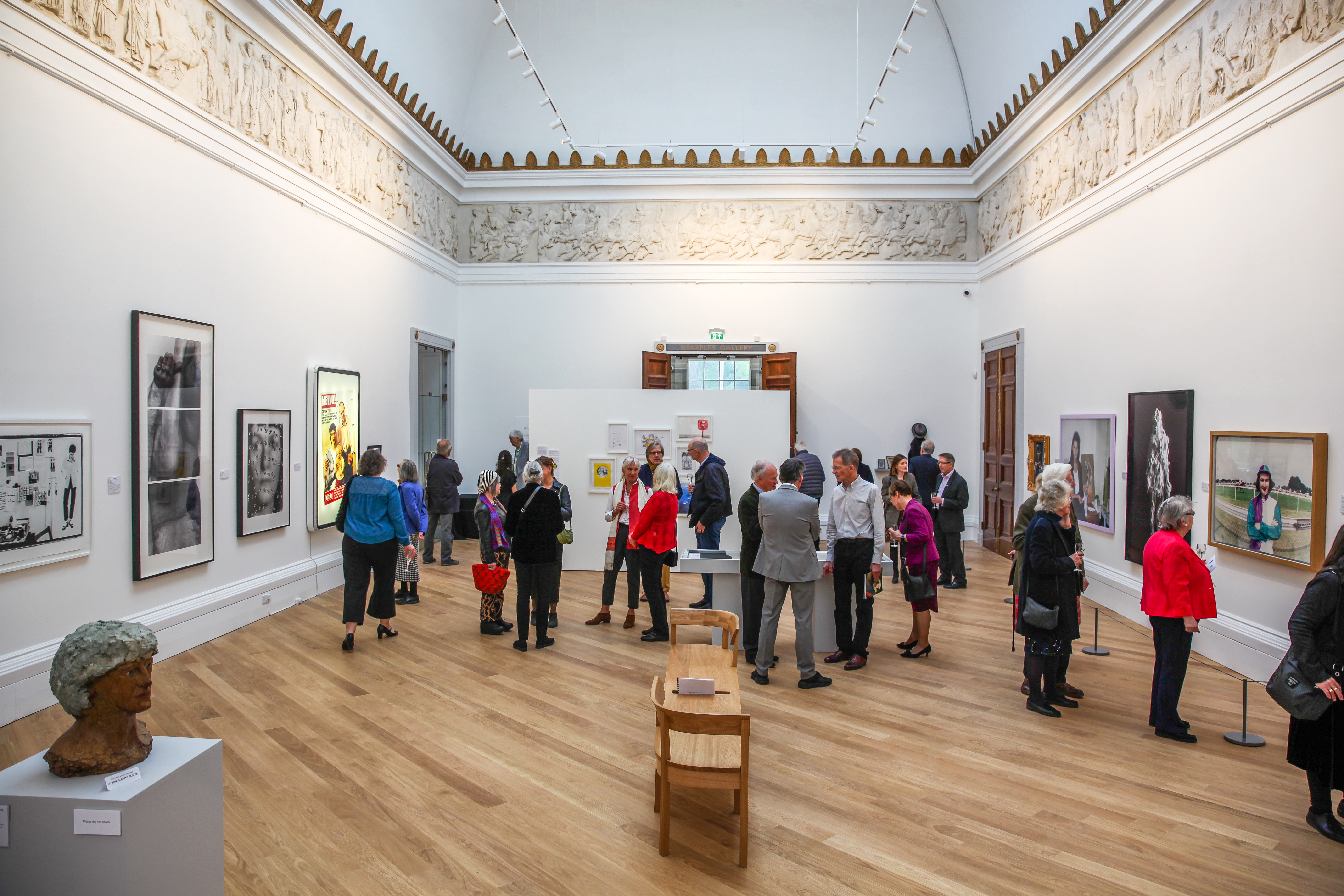 The Sharples gallery filled with people and the opening exhibition 