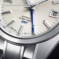 Grand Seiko SBGJ263 44GS GMT in Ever-Brilliant Steel with white Mt. Iwate dial. 