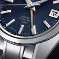 Grand Seiko SBGJ267 44GS GMT in Ever-Brilliant Steel with blue Mt. Iwate dial.
