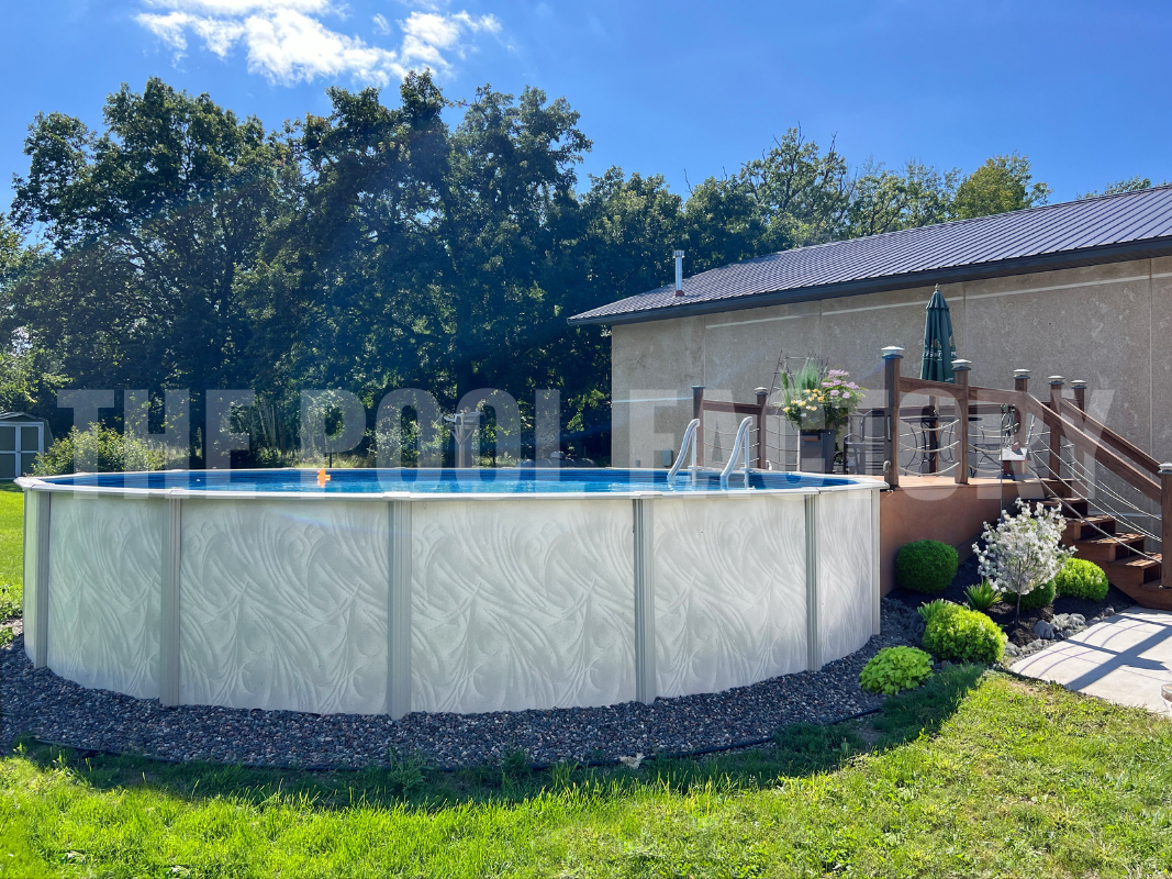 Family-friendly above ground round pool in a garden setting with a partial deck for easy access