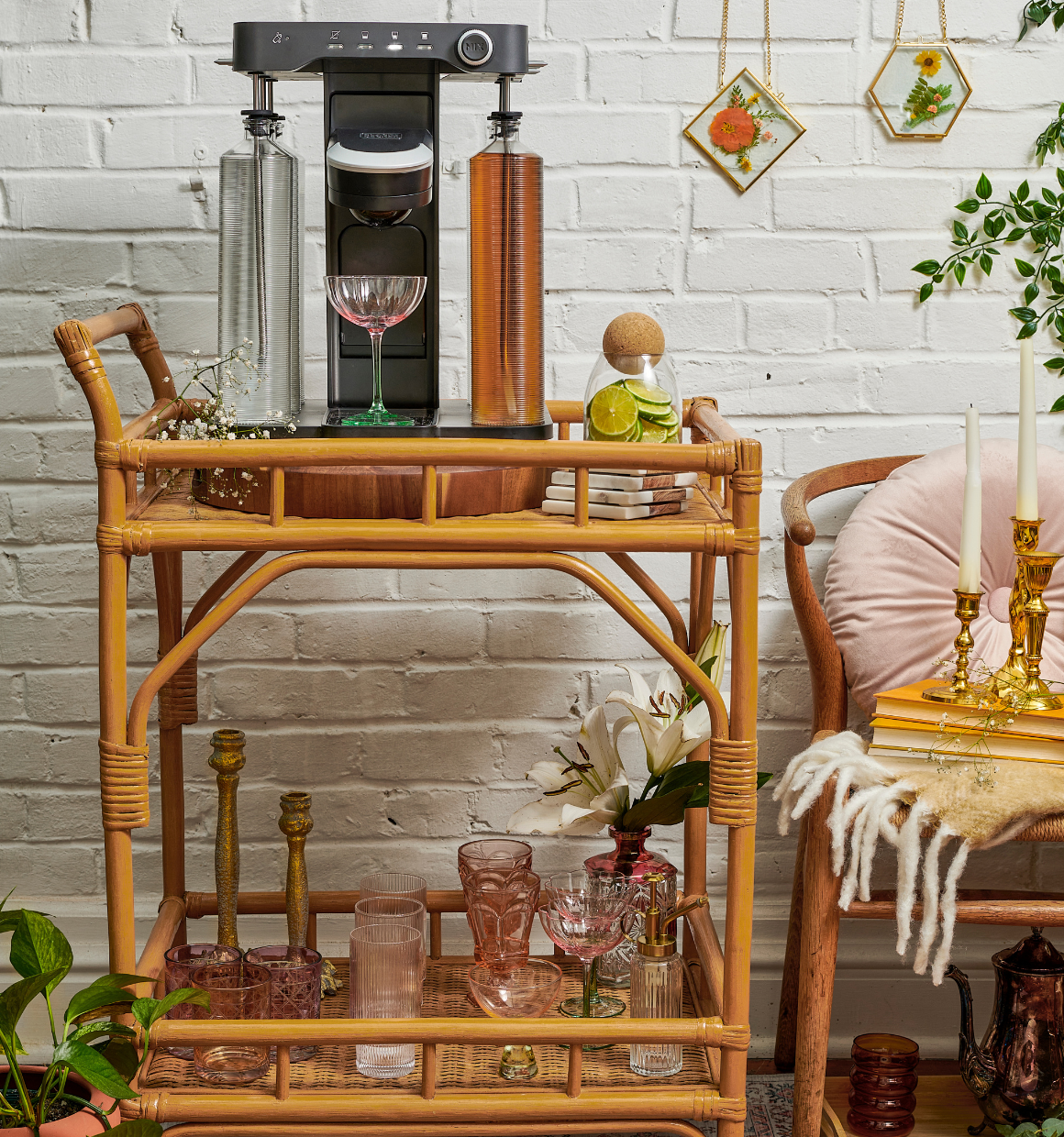bev by BLACK+DECKER(TM) cocktail maker sitting on an artsy eclectic bar cart