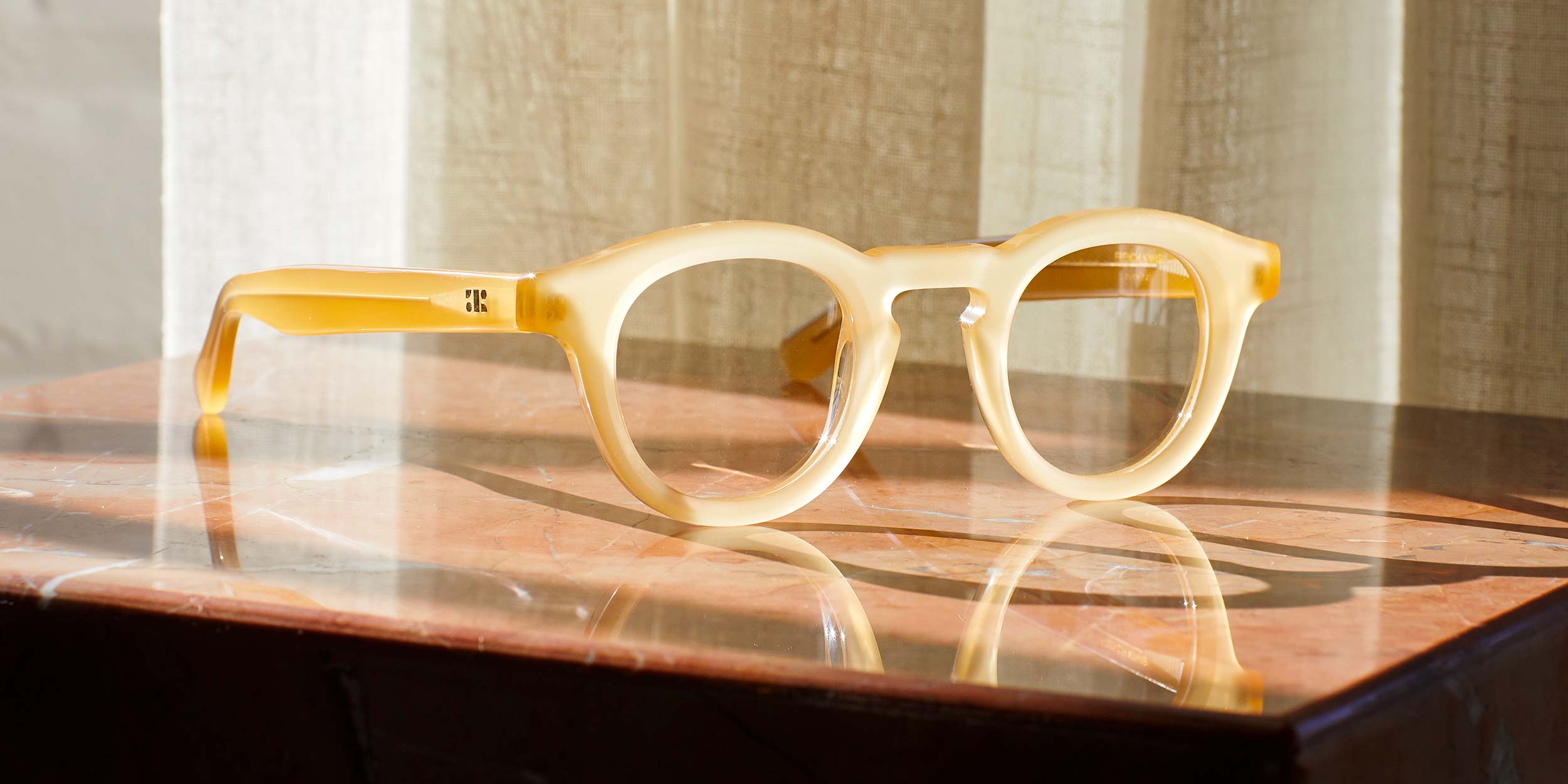Photo Details of Jude Grey Tortoise Reading Glasses in a room