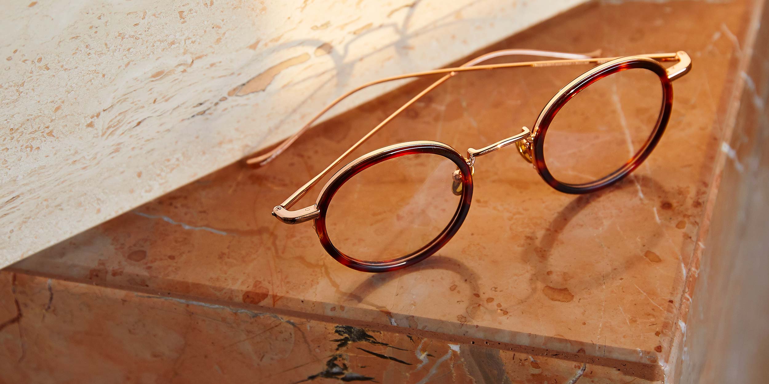 Photo Details of Nicolas Cobalt & Rose Gold Reading Glasses in a room