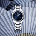 Grand Seiko SBGW299 blue dial sun ray pattern watch.