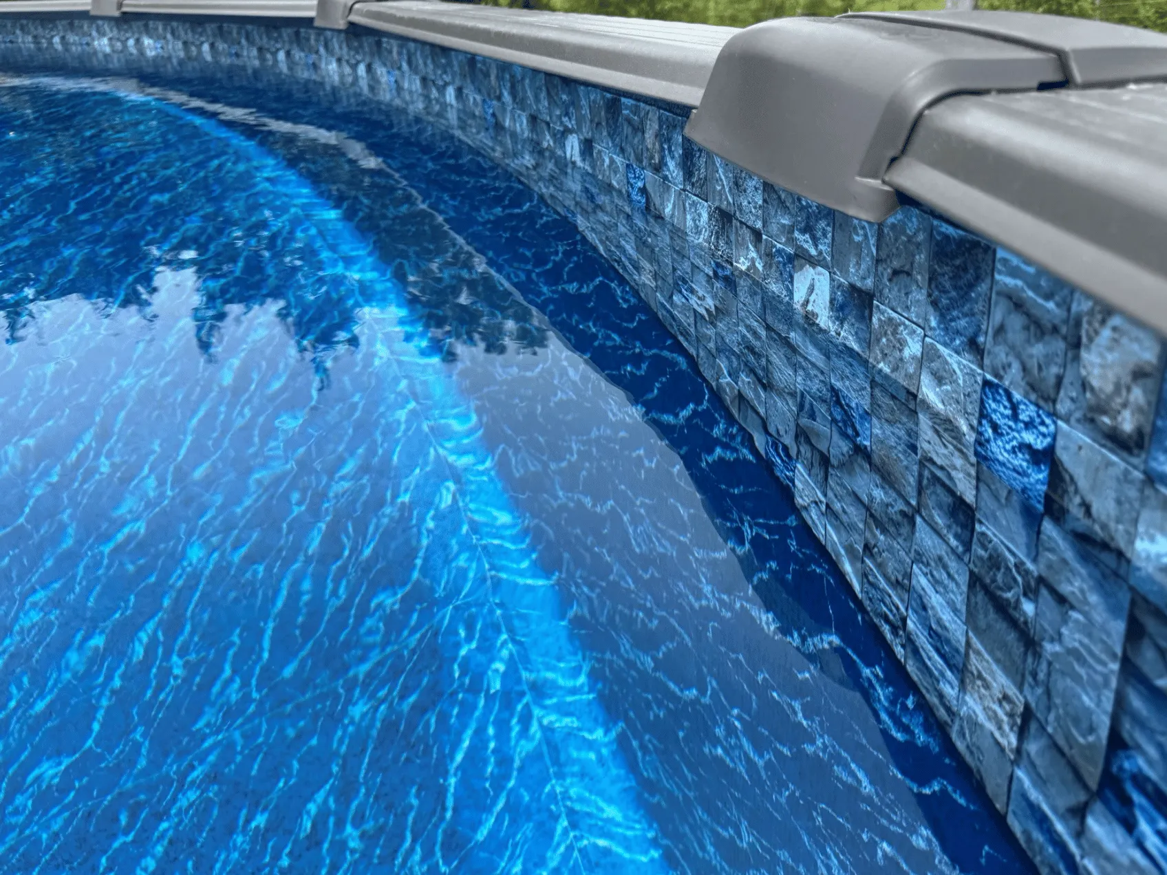 Soho oval J-Hook pool liner in a Melenia oval pool 