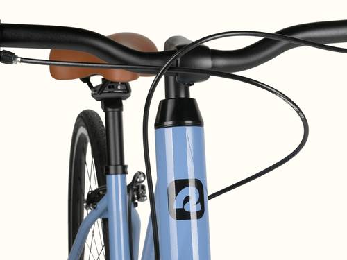 Close-up of a blue bicycle's head tube and handlebar, with visible brake cable and saddle.