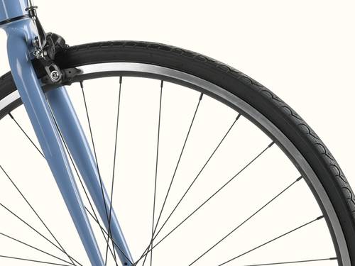 Close-up of a blue bicycle's front wheel, tire, spokes, and brake against a white background.