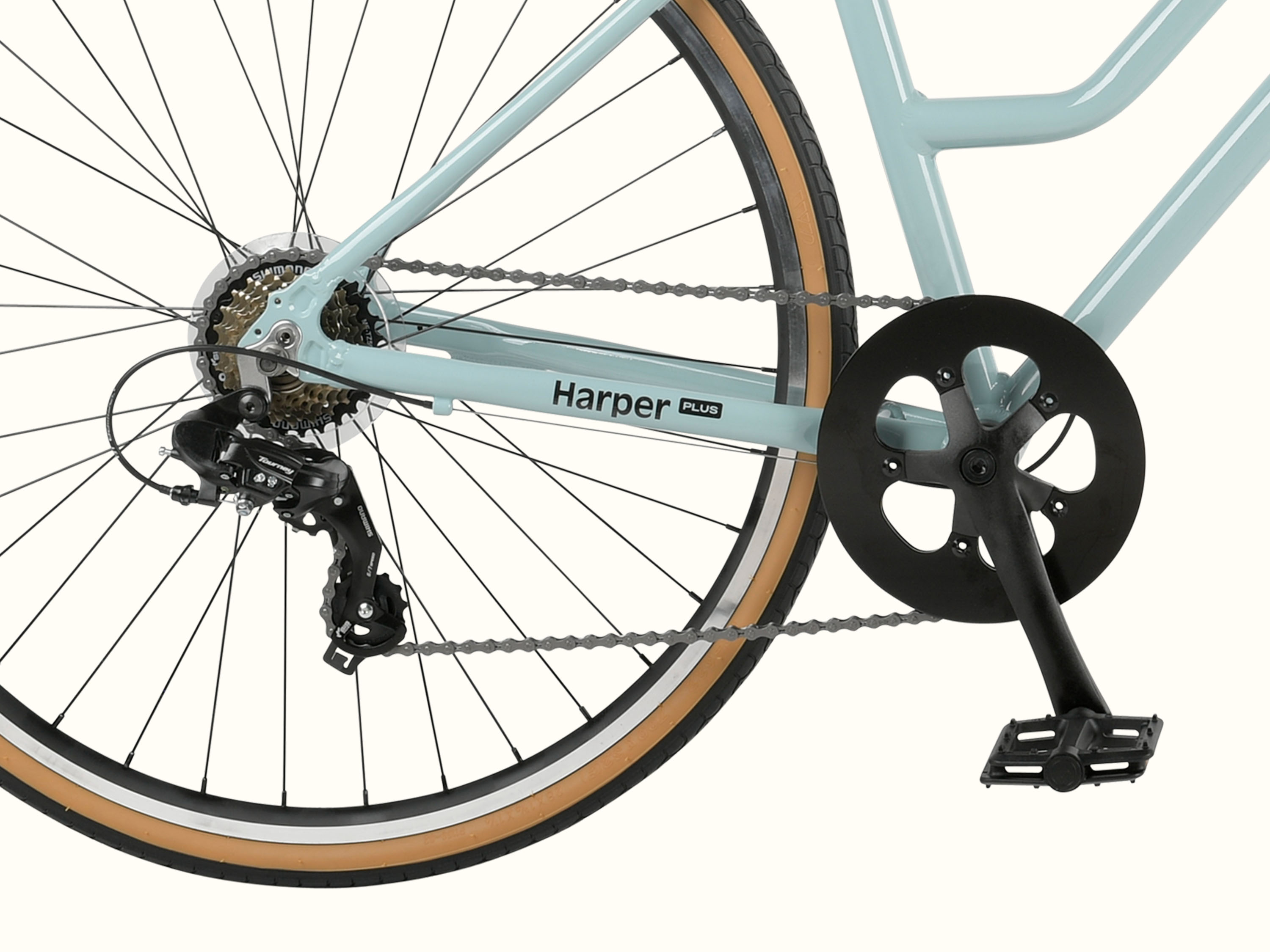 Close-up of a Harper Plus 7-Speed bicycle's rear wheel, chain, and pedal mechanism with a light blue frame.