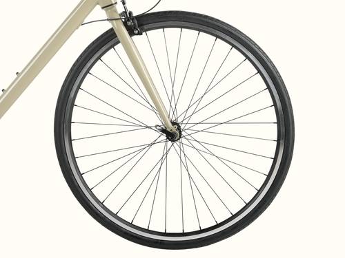 Bicycle wheel with thin spokes on a beige bike frame, isolated on white.