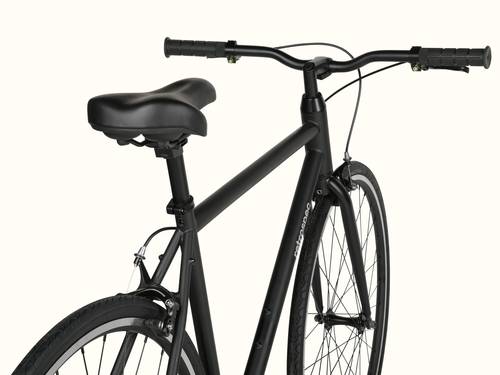 Black bicycle with a focus on the saddle and handlebars against a white background.