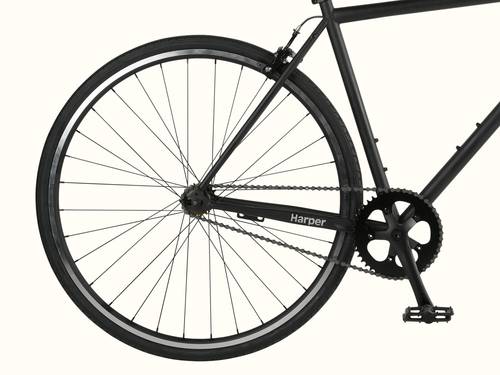 A close-up of a black fixed-gear bike's rear wheel, chain, and pedal against a white background.