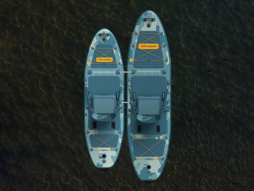 An aerial view of the June Inflatable Fishing Paddle Board Kayak Hybrid 11’6” and June Nano Kids’ Inflatable Fishing Paddle Board Kayak Hybrid tethered together on a calm body of water.