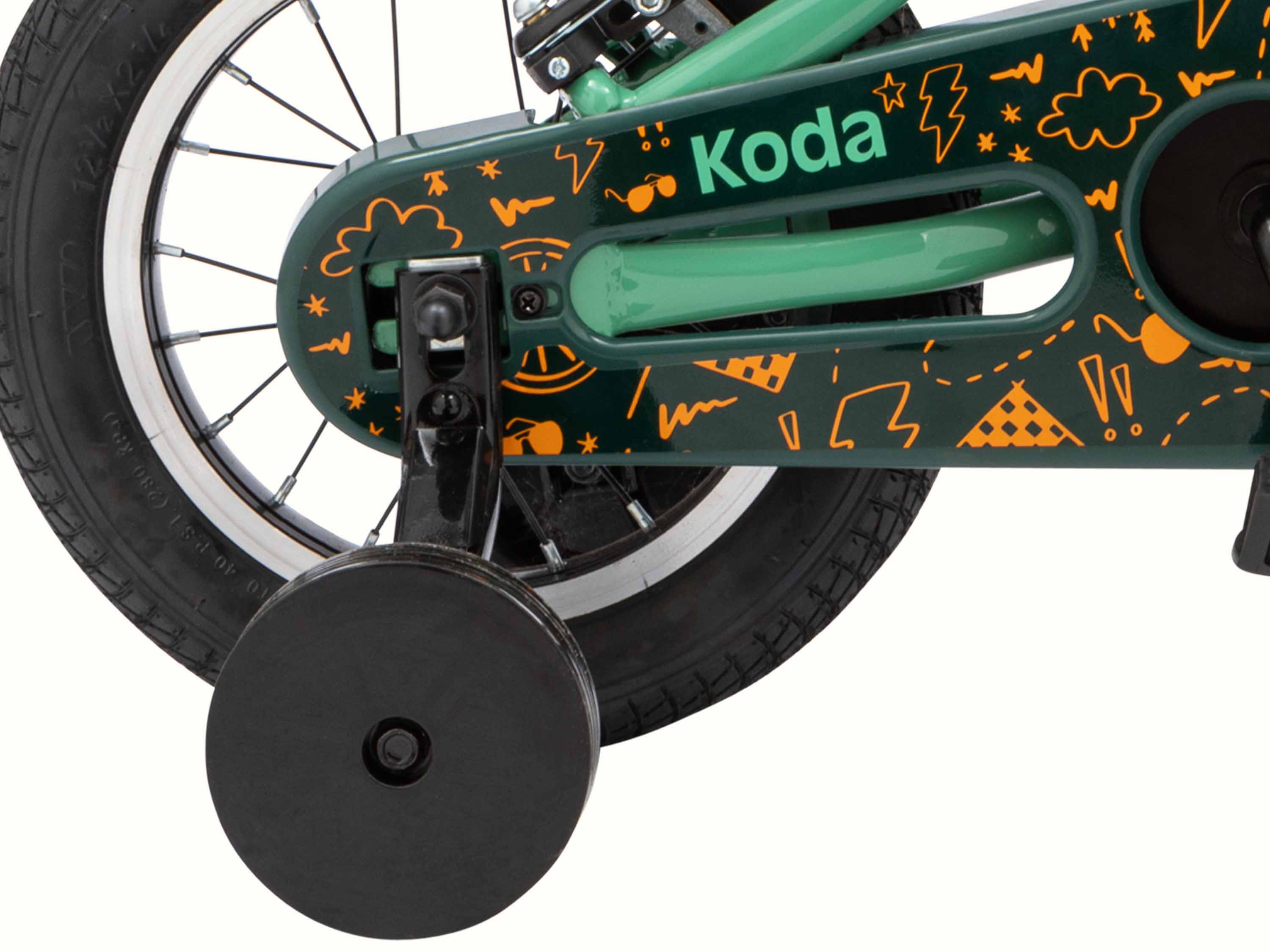 Close-up of a Koda 12 Inch green bicycle with orange and yellow graffiti-style decoration and the brand 