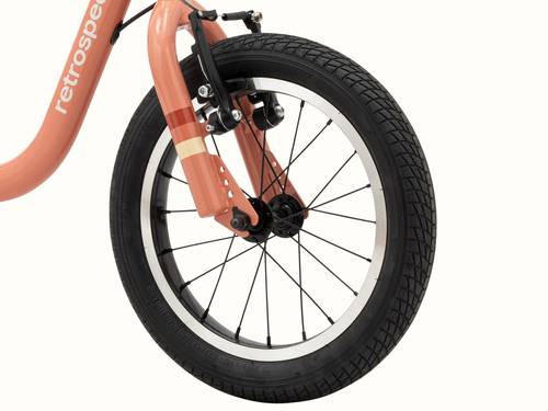 Close-up of the Kids' Cub Plus XL rose pink bicycle wheel with black tire and disc brakes.