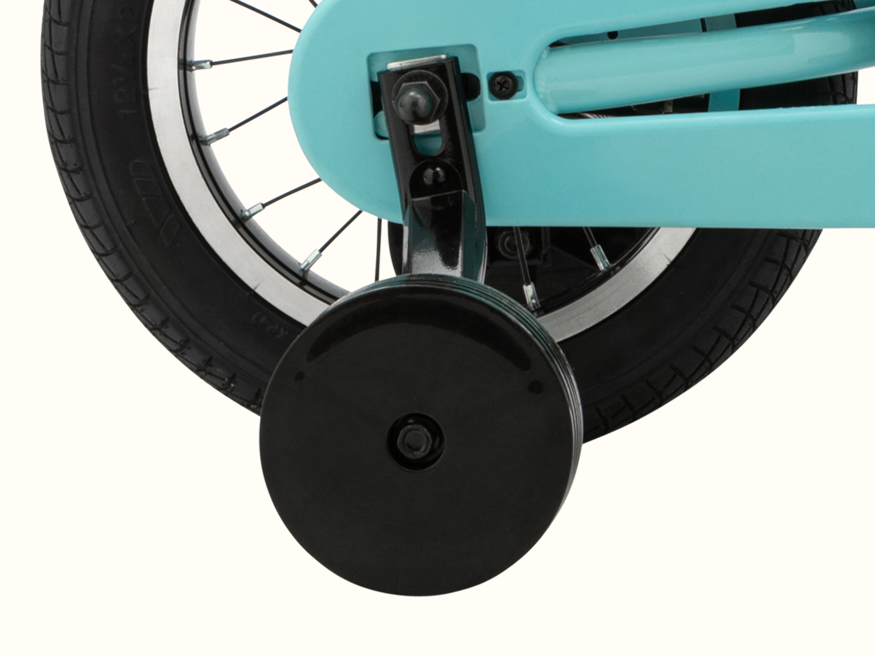 Close-up of the Robin's Egg Blue Koda Plus Kids bike frame with black training wheel attached.