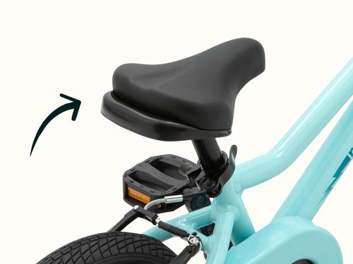 Close-up of the Koda Plus 12 inch Kids black bike saddle on the Robin's Egg blue bike frame with an arrow pointing to the built-in handle.