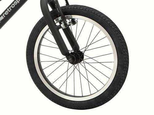 Close-up of the black Koda Plus 16" Kids' Bike front wheel and part of the fork on a white background.