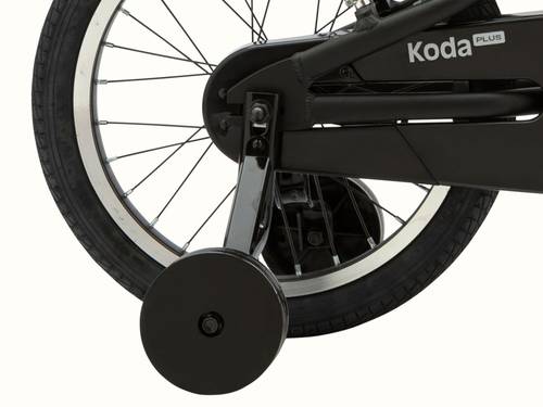 Close-up of the Koda Plus 16" Kids' Bicycle's rear wheel with "Koda Plus" label on the chain guard, and a focus on the attached training wheels.