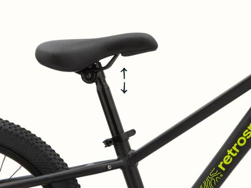 Koda Plus 20" Kids' Black bicycle seat with arrow indicating adjustable height on a black bike frame.