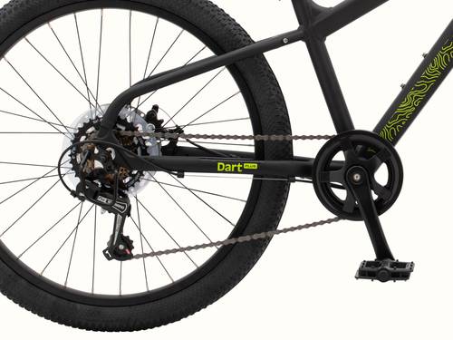 Close-up of the Dart Plus 24" Kids' Bicycle's rear wheel, gears, chain, and pedal mechanism, with "Dart Plus" branded on the frame in neon green, on a white background.