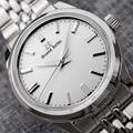 Grand Seiko SBGW305 sunray dial watch on bracelet.