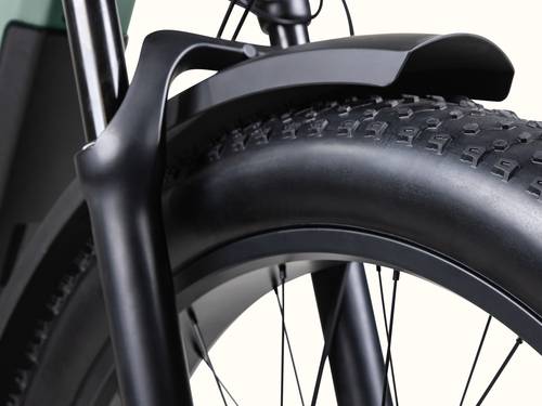 Close-up of the Grateful Dead Koa Rev+ Electric Bike's front fork and thick tire, showcasing the matte black fender and textured tread design.