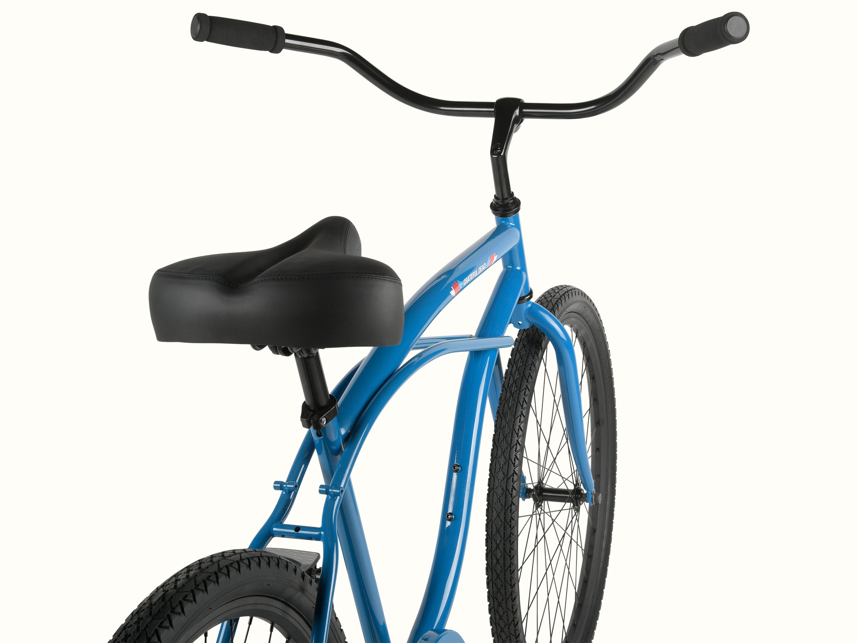 A close-up of a blue bicycle featuring a comfortable black seat and black handlebars, showcasing it's upright riding design.