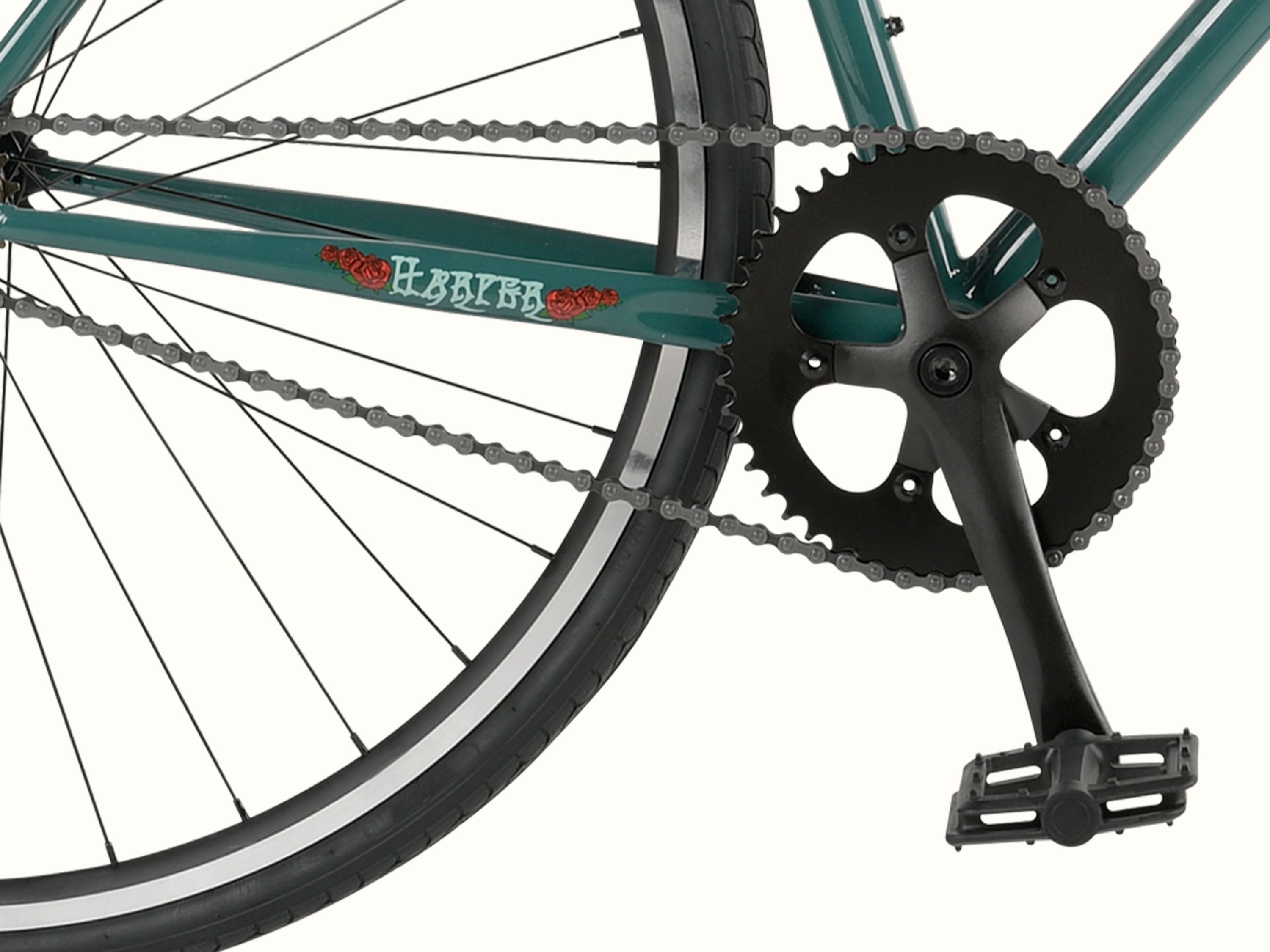 Close-up of a green Grateful Dead Harper Fixie Single Speed Bike's crankset and pedals, featuring a black chainring and 