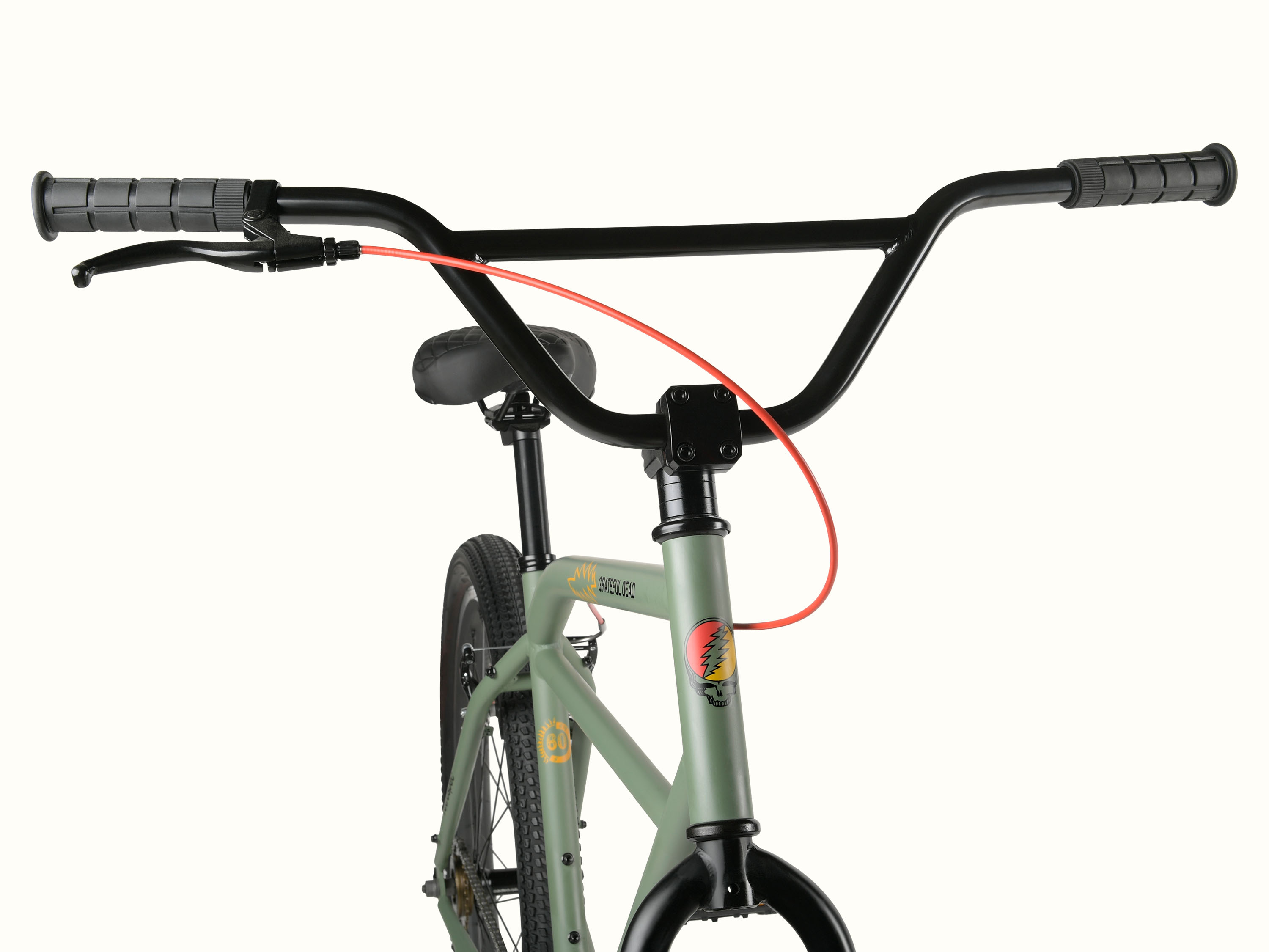 Close-up of the Grateful Dead Sully Klunker Single Speed Bike's handlebars, featuring black grips, a red brake cable, and a green frame with iconic Grateful Dead artwork, such as 