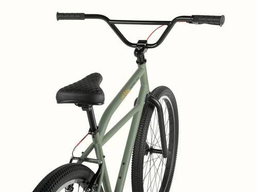 A close-up view of the olive green Grateful Dead Sully Klunker Single Speed Bicycle with black handlebars, a quilted black seat, and knobby tires, showcasing its sleek design.