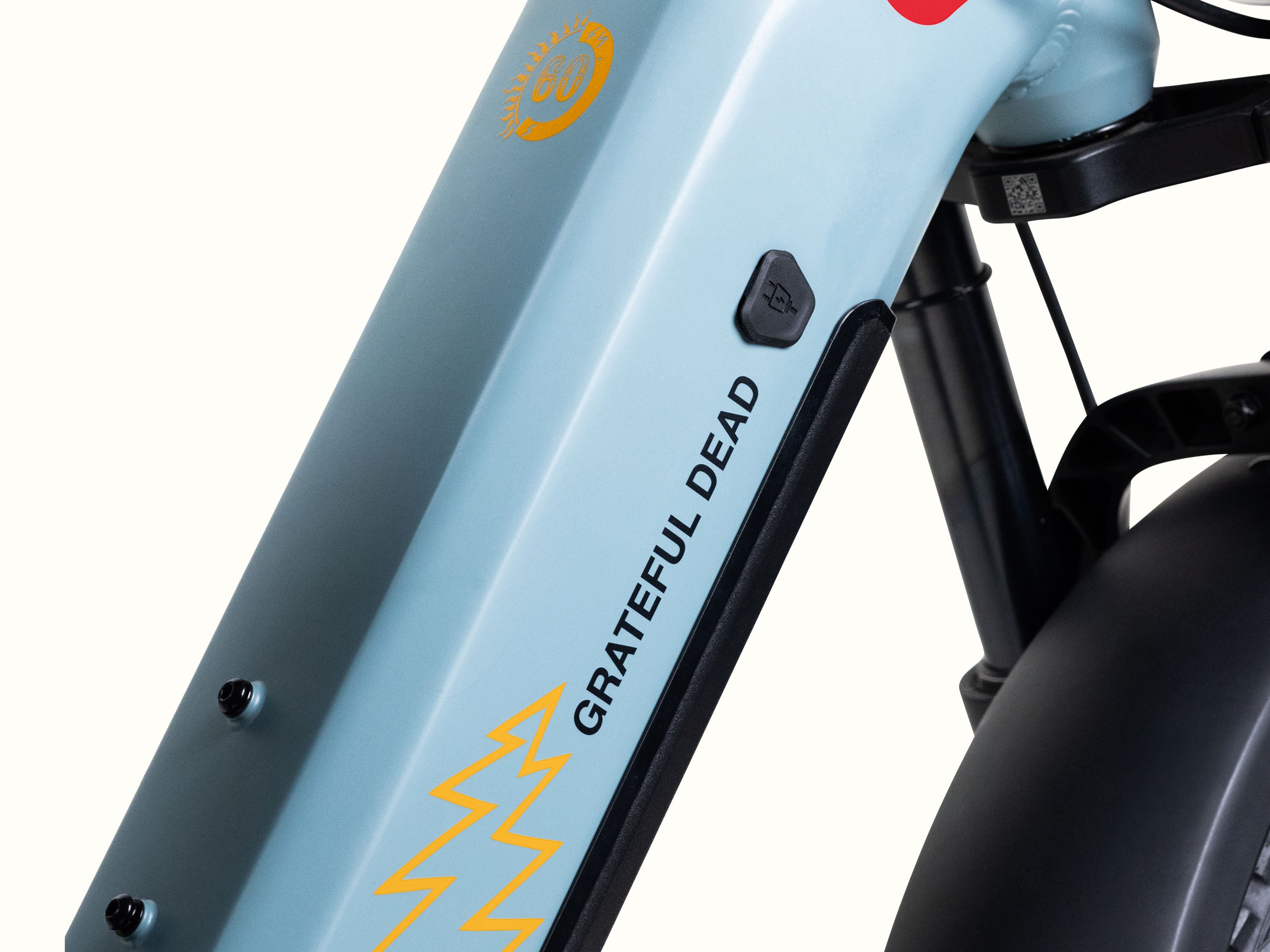 Close-up of the light blue Grateful Dead Valen Rev+ Electric Fat Tire Bike's frame featuring the 