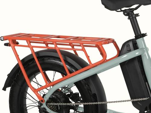 A close-up of the mint Roo Rev XL Electric Cargo Bike's orange rear rack.