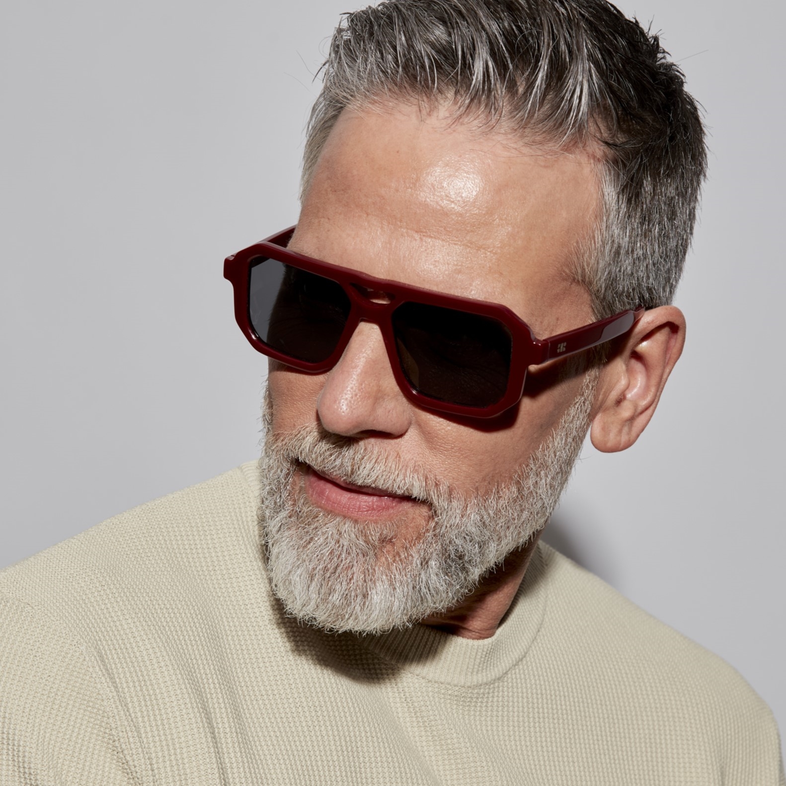 Photo of a man or woman wearing Angelo Sun Burgundy Sun Glasses by French Kiwis