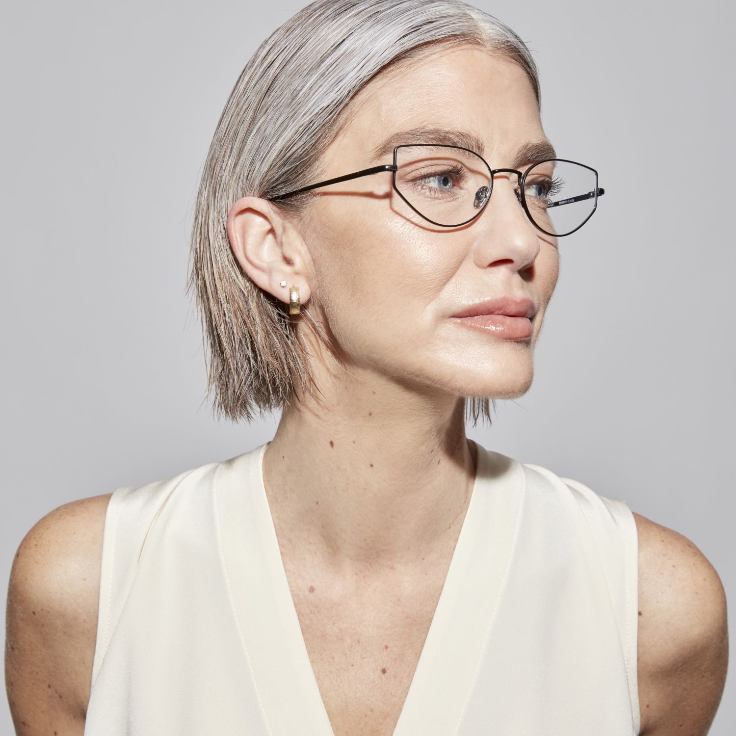 Photo of a man or woman wearing Dakota Silver Reading Glasses by French Kiwis