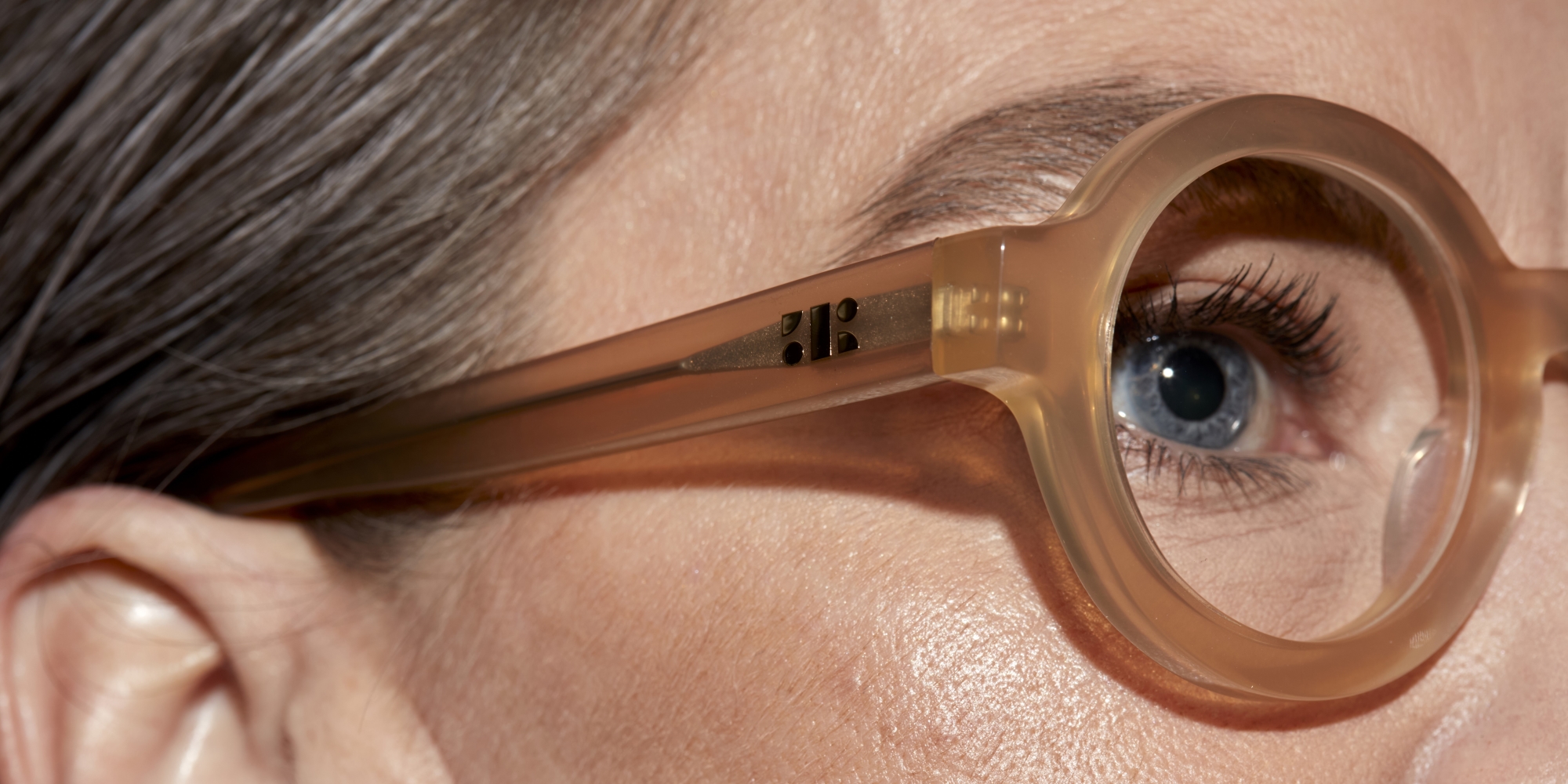 Photo Details of Lola Apricot Reading Glasses in a room