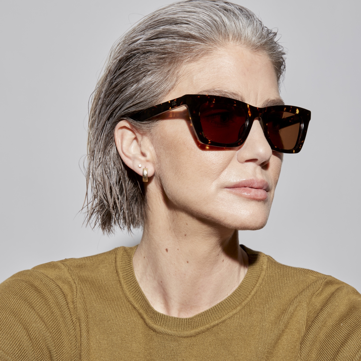 Photo of a man or woman wearing Manu Sun Grey Marble Sun Glasses by French Kiwis