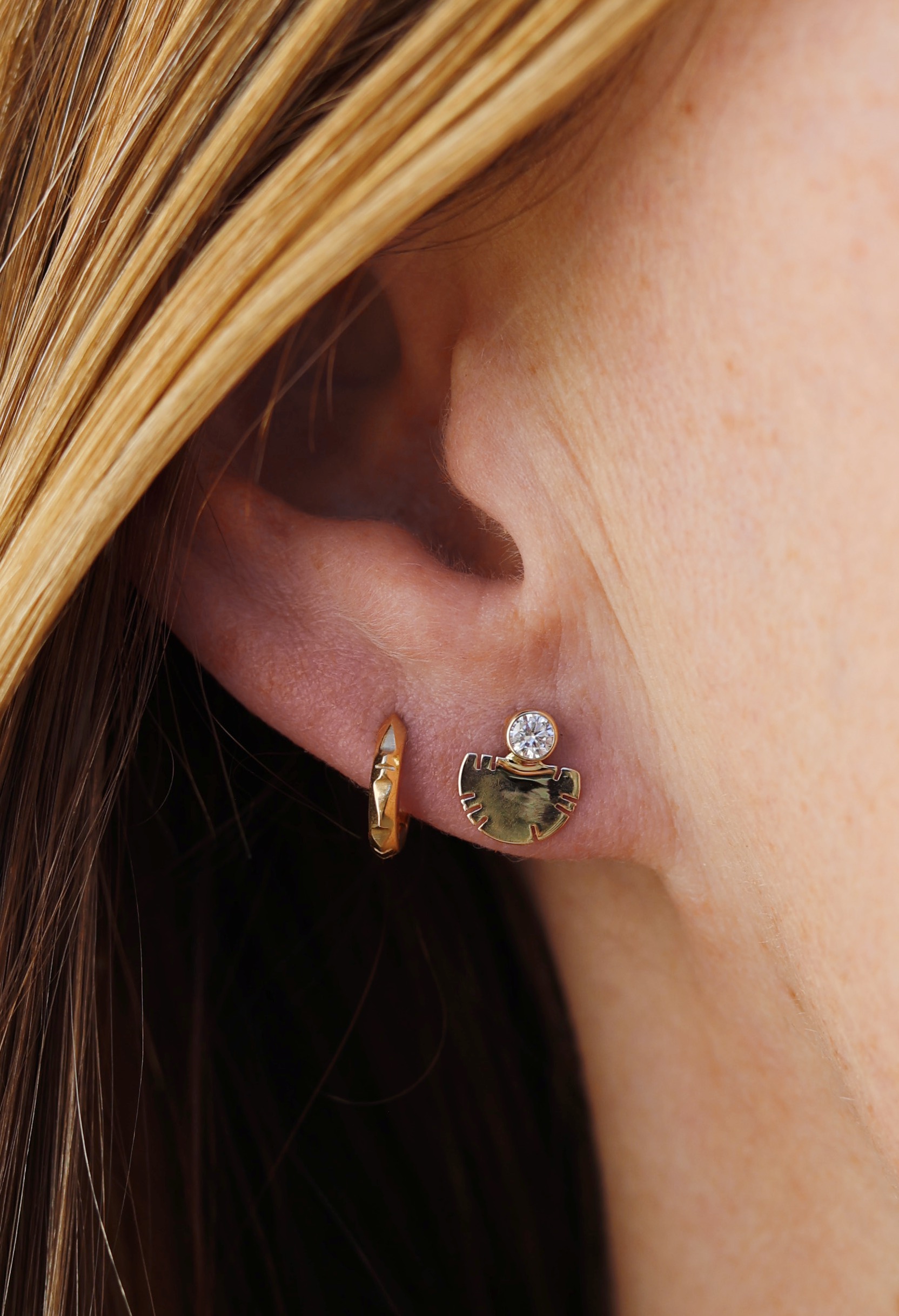 White Colorado topaz is bezel set in 14k yellow gold earrings