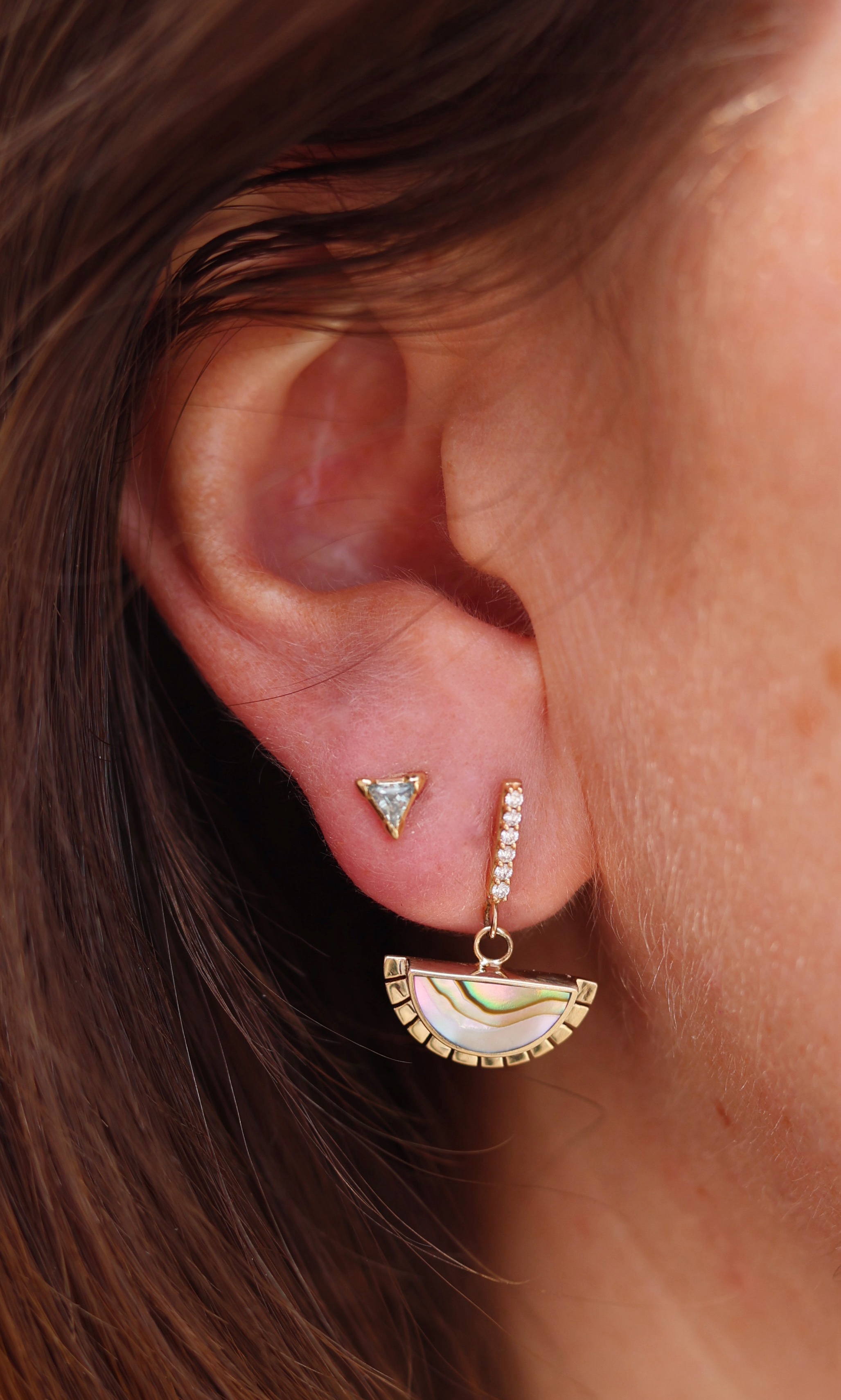 A half moons earrings with inlaid abalone shell.
