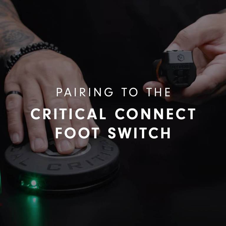 Hands holding a device and a foot switch with text "Pairing to the Critical Connect Foot Switch."