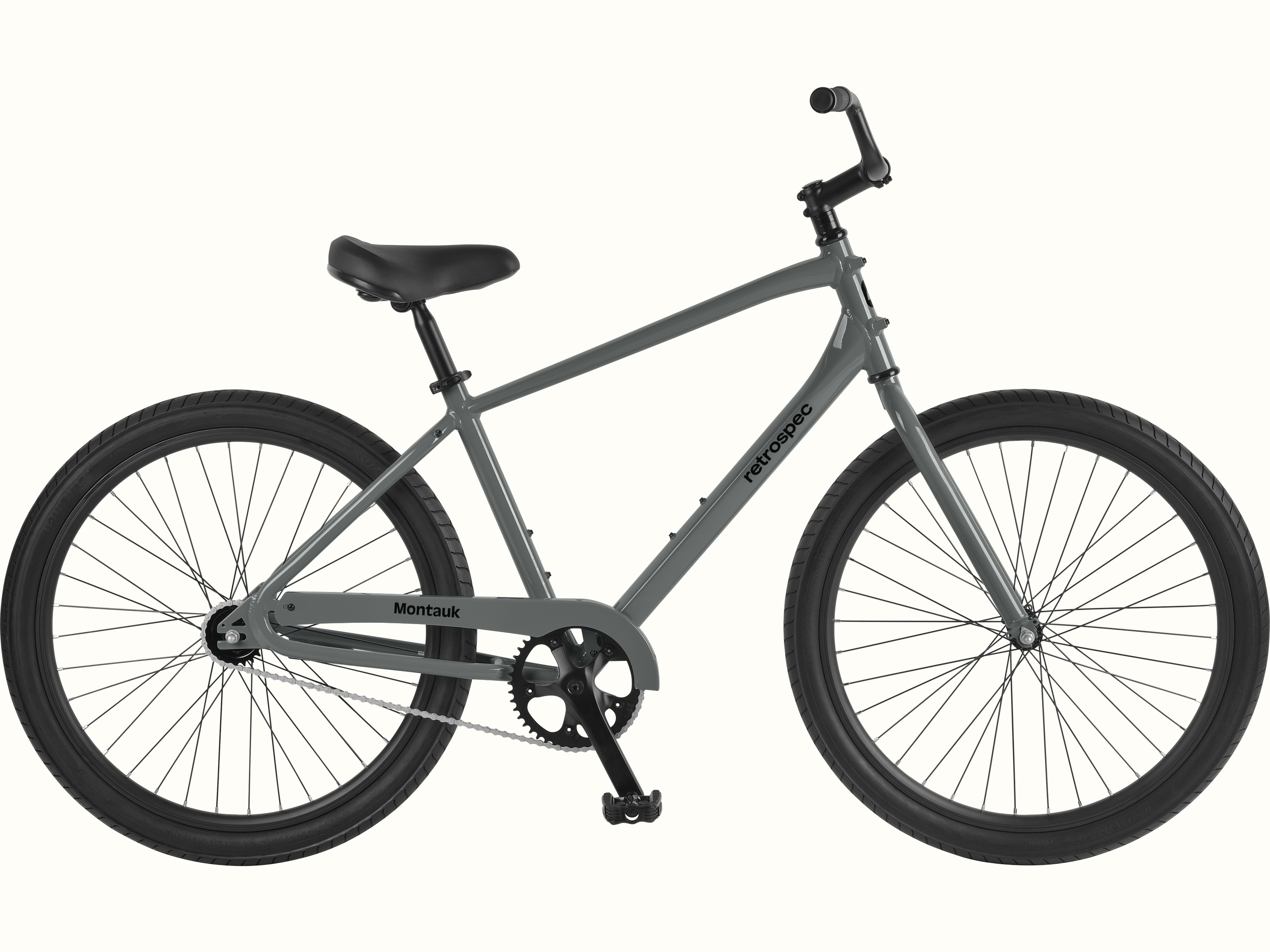 Sleek gray retrospec Montauk cruiser bike with black saddle, wide tires, and single-speed chain drive on a white background.