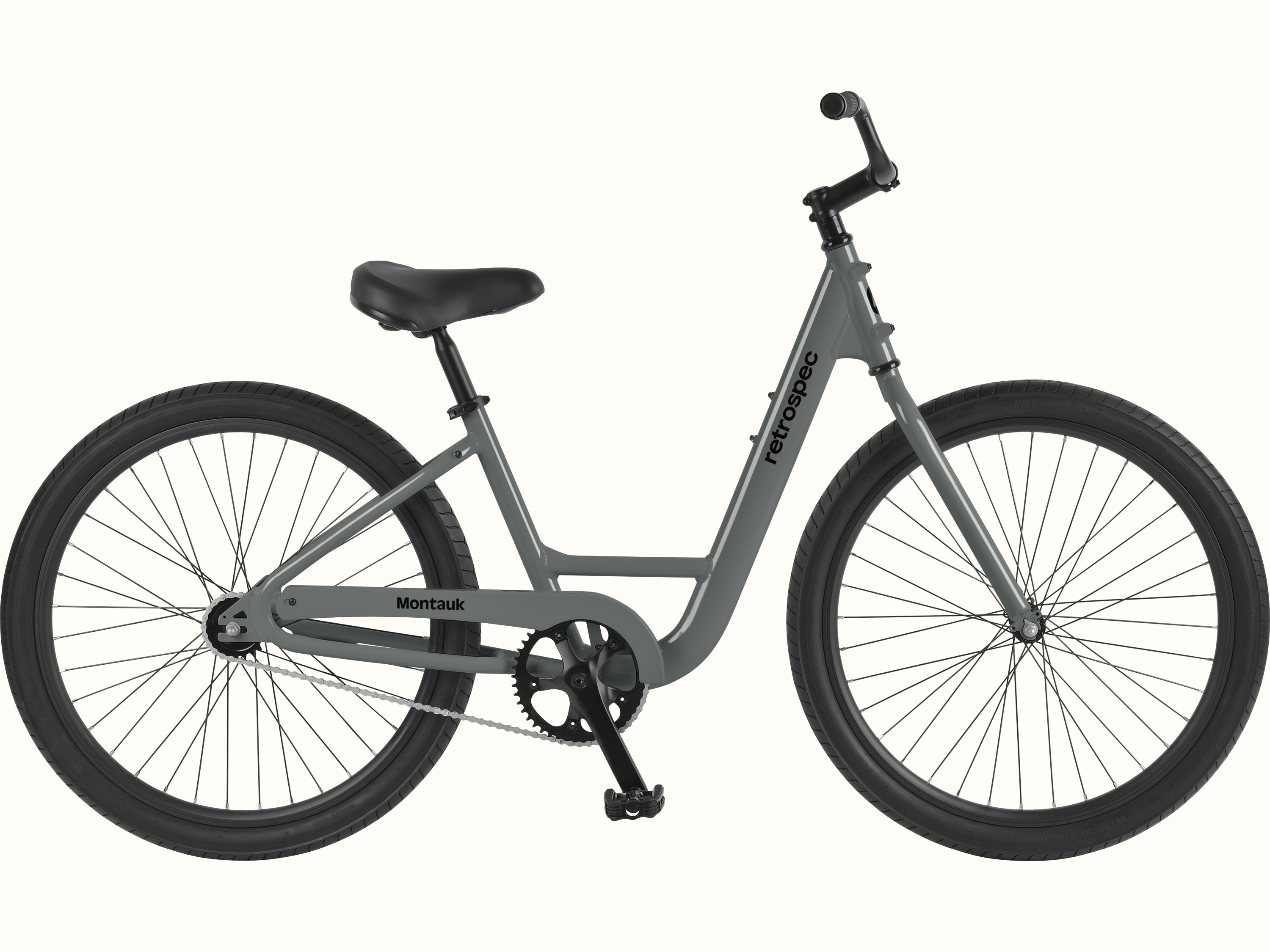 retrospec Montauk step through cruiser bike in Graphite with a step-through frame, black saddle, and single-speed drivetrain, shown in a full side profile on a clean white background.