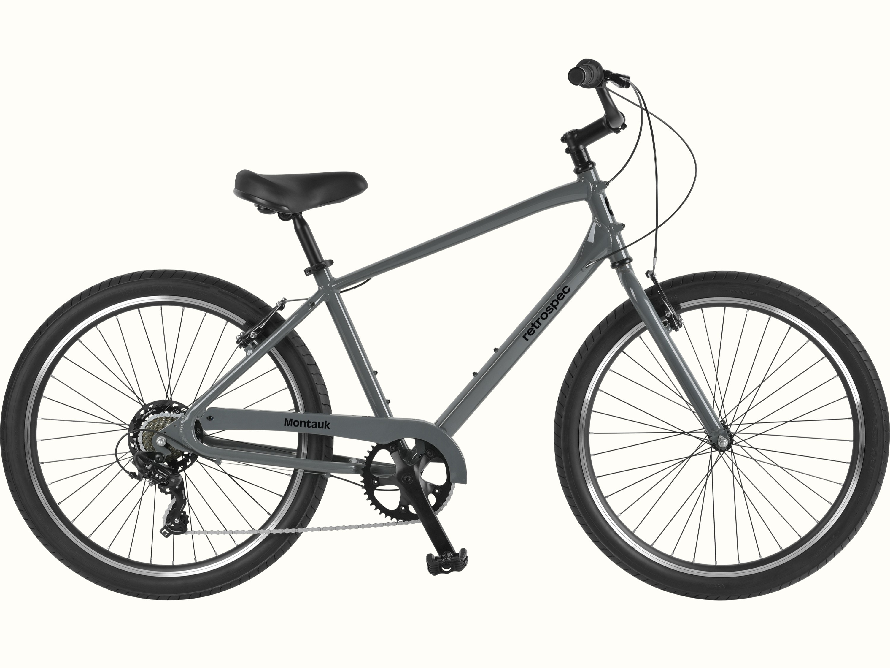 retrospec Montauk 26 7-Speed Comfort Bike in Graphite, full side view showing the low-step aluminum frame, wide tires, upright handlebar, and cushioned saddle, ready for casual rides and everyday adventures.
