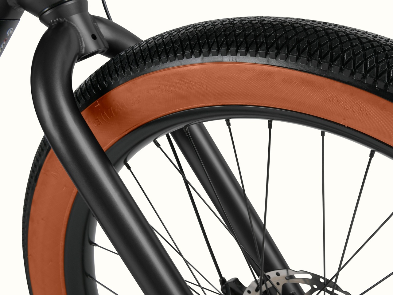 Close-up of the Joe Rev 2 BMX fork and tire showing its grip and brown sidewalls.