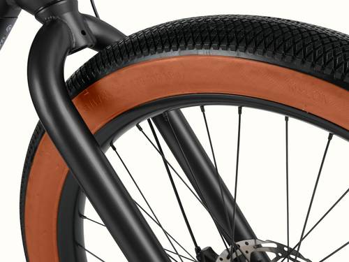 Close-up of the Joe Rev 2 BMX fork and tire showing its grip and brown sidewalls.