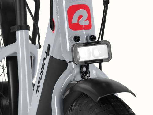 A close-up of the headlight on a gray Abbot Rev 2 Commuter Electric Bike.