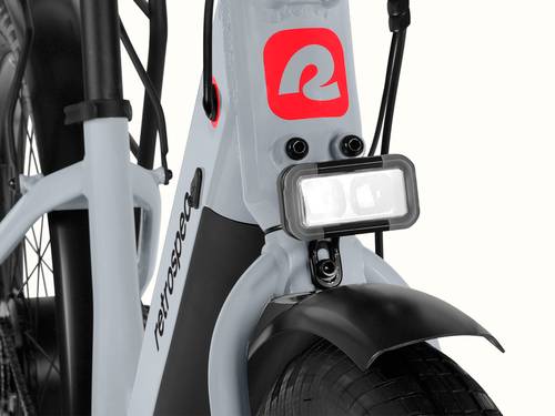 A close-up of the headlight on a gray Abbot Rev 2 Commuter Electric Bike.