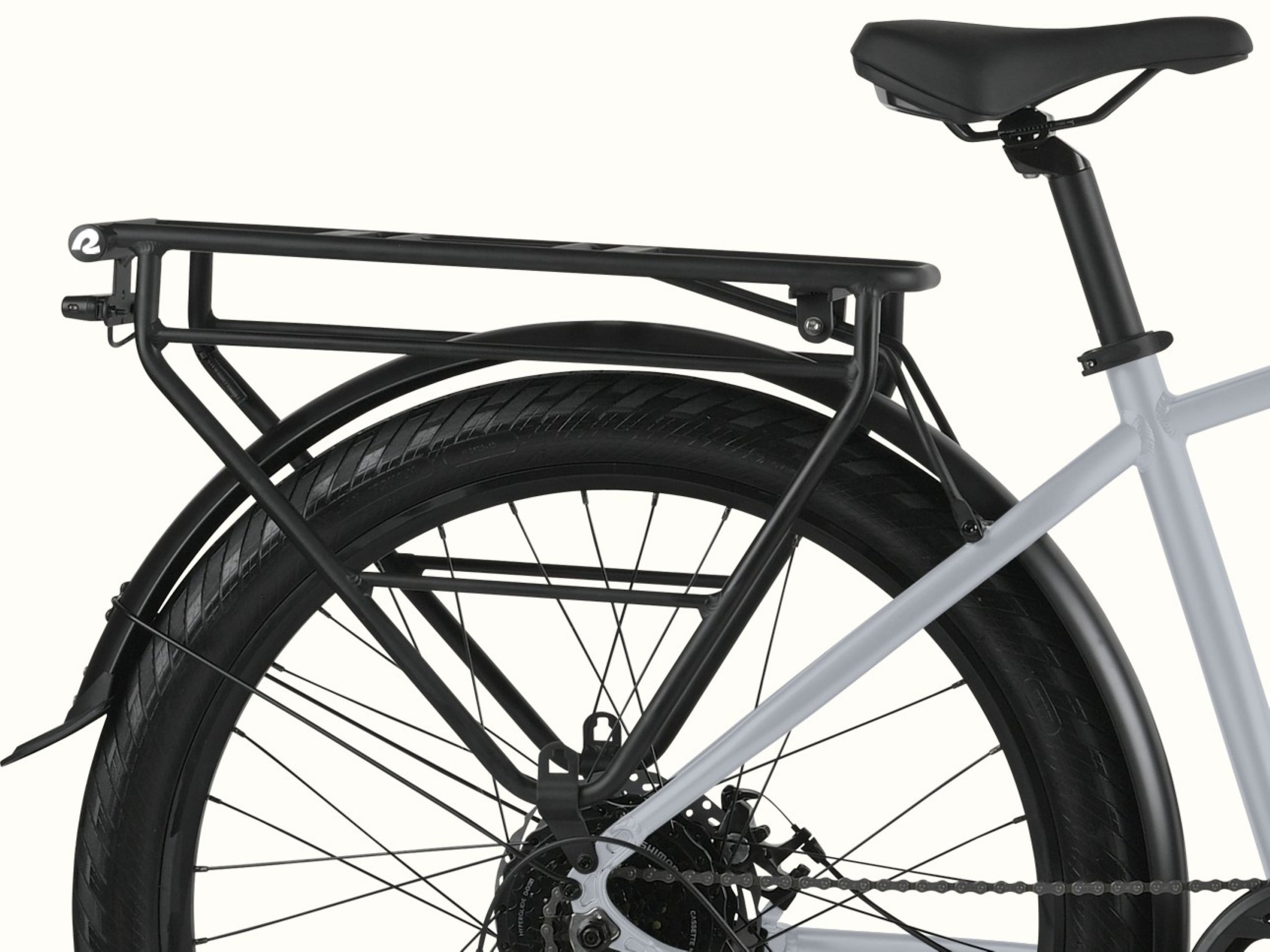 A close-up of the attached black rear rack on the Abbot Rev 2 Commuter Electric Bike.
