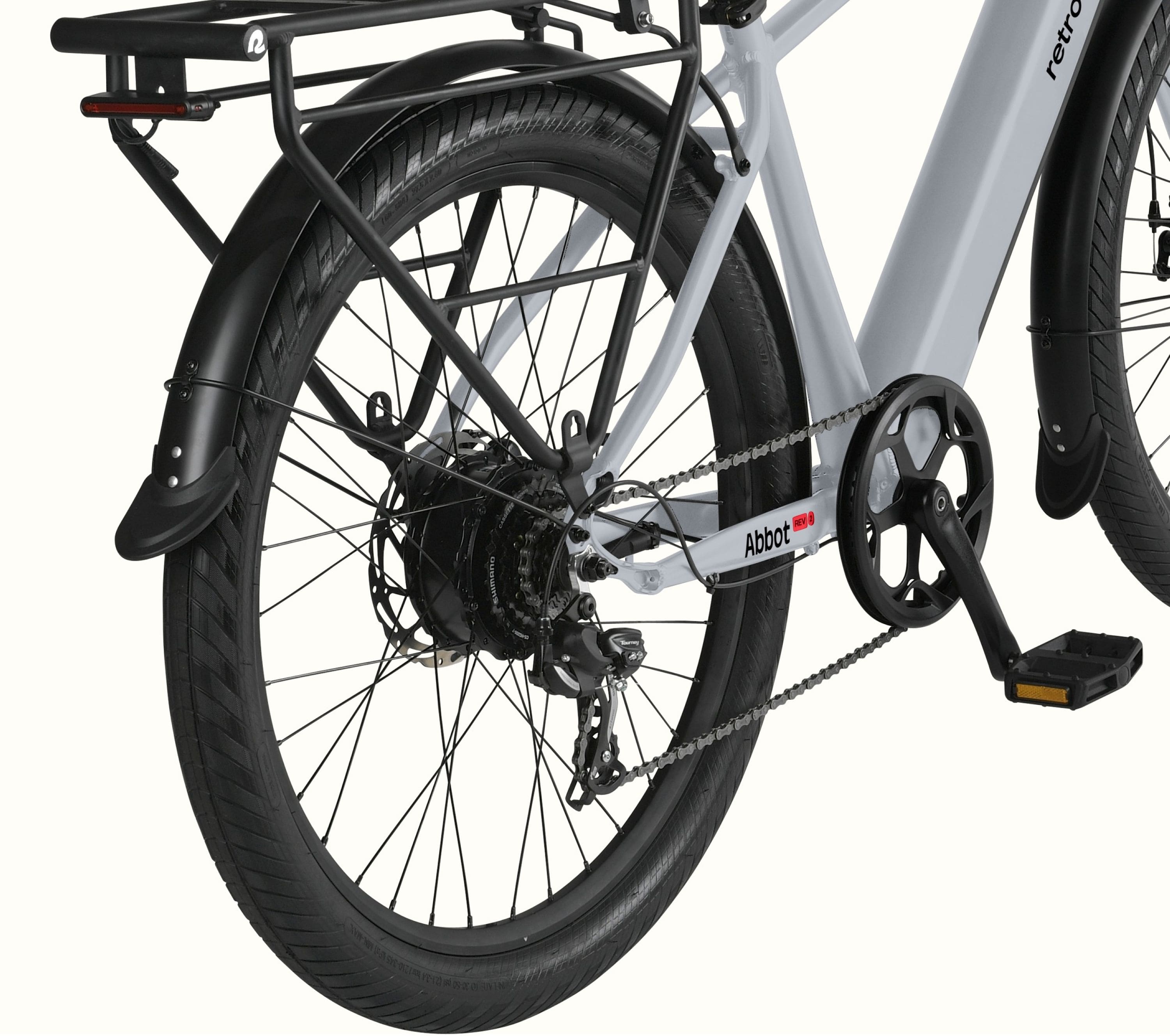 A close-up of thee removal rear wheel and rear rack on the gray Abbot Rev 2 Commuter EBike.
